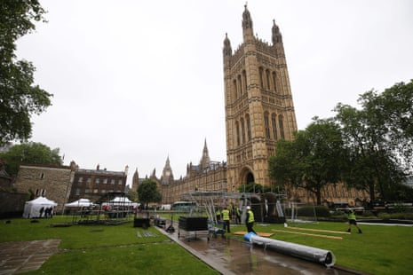 Workers erect scaffolding for television studios outside the Houses of Parliament today.