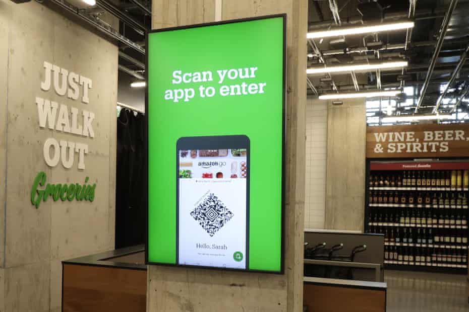 A sign at the new Amazon Go Grocery store in Seattle tells customers how to begin shopping.