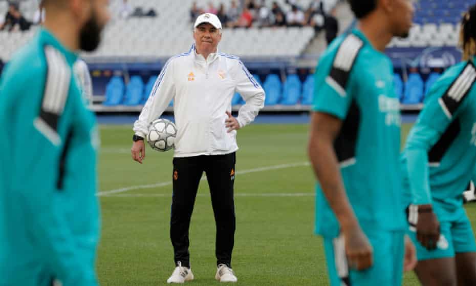 Carlo Ancelotti watches his Real Madrid players train at the Stade de France