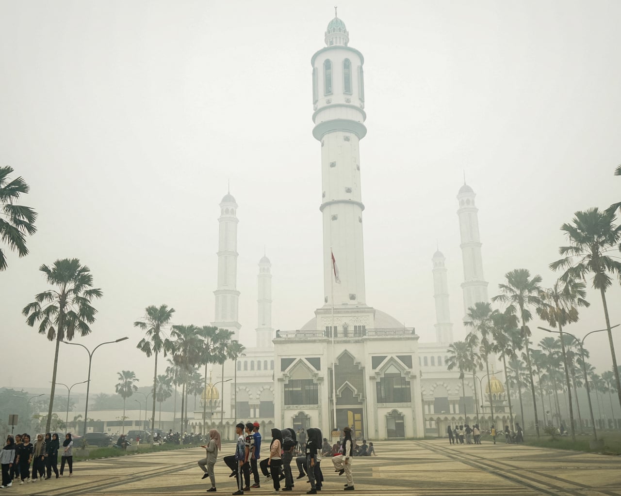 Students conduct marching drills amid haze from forest and land fires at the courtyard of the Mujahidin Grand Mosque in Pontianak, West Kalimantan.