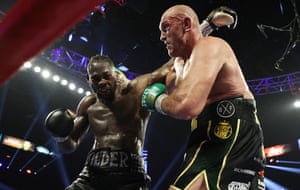 Tyson Fury and Deontay Wilder trade blows during their bout for Wilder’s WBC and Fury’s lineal heavyweight title in February 2020.