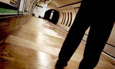 Lone woman at end of London Underground platform