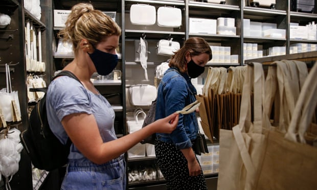 Shoppers wear face masks in London.