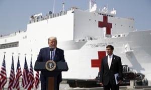Donald Trump speaks in front of the US navy hospital ship USNS Comfort in Norfolk, Virginia, before it sailed to New York City.