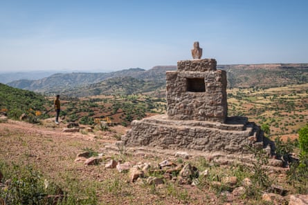 A stone structure on a hillside