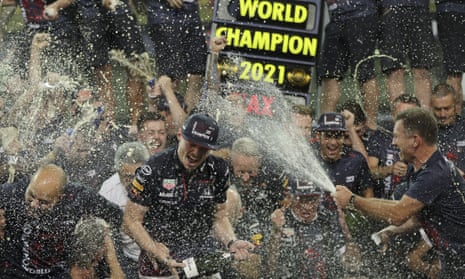 Max Verstappen, centre, celebrating with the Red Bull team principal, Christian Horner, far right after winning the 2021 F1 drivers’ championship.