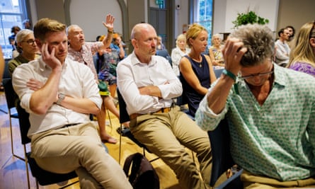 Simon Gait, of Acorn Housing, attending the meeting flanked by colleagues.