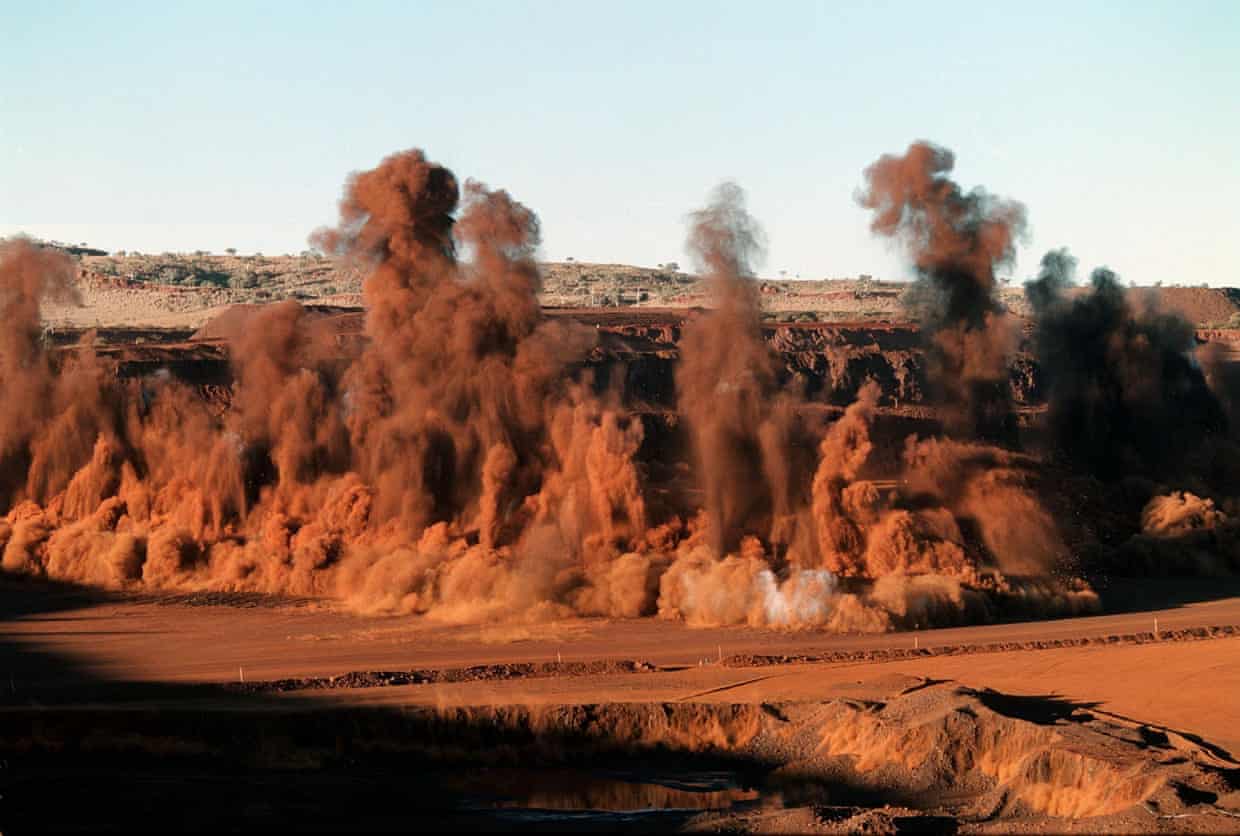 Plumes of red dust rise
