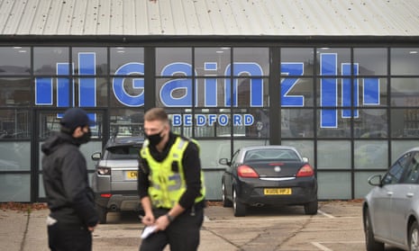 Police outside Gainz Fitness &amp; Strength in Bedford in November 2020, after it defied lockdown rules by staying open