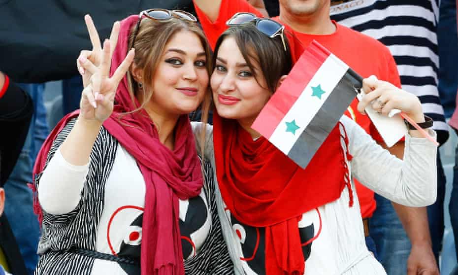 Syrian fans at the Azadi stadium in Tehran, where Iranian women were barred from the match.