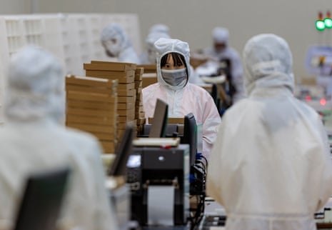 Employees work at EGING Photovoltaic solar panels factory in Changzhou, Jiangsu Province, China.