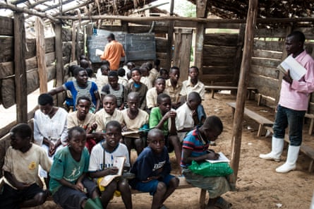 Two classes share one classroom, in the Mpati area of North Kivu province, DRC