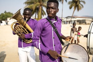 Members of the Area 10 Scout brass band play along Lumely beach in Freetown