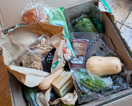 The contents of a Hello Fresh box, which includes fresh veg, neat and sauces.