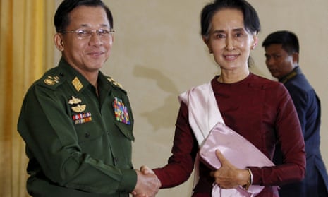 Myanmar’s commander-in-chief, Min Aung Hlaing, shakes hands with Aung San Suu Kyi in 2015