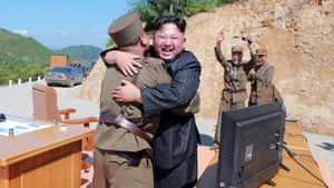 The North Korean leader Kim Jong-un celebrates the successful test of the Hwasong-14 missile.