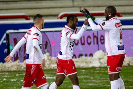 Fabrice Olinga celebrates after scoring for Mouscron against Genk. Mouscron has been owned by four different people since Olinga joined in 2015