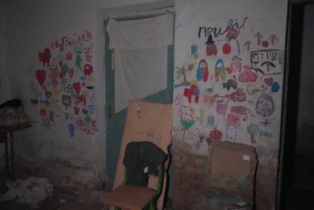 Colourful children’s drawings on a white wall