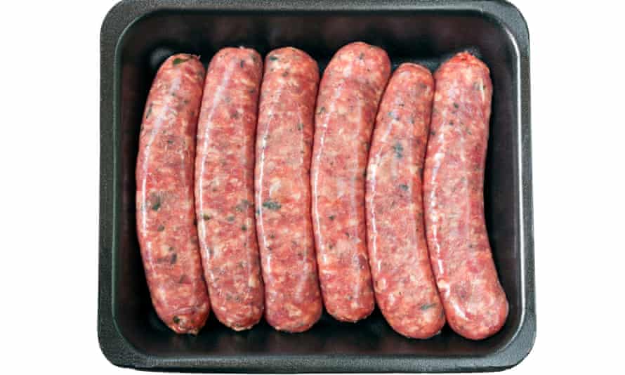 Raw sausages on styrofoam tray, isolated on white.