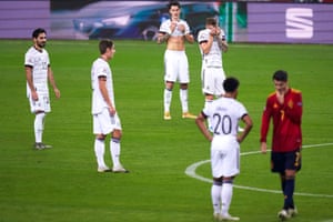 The Germany players react during their heavy defeat to Spain.