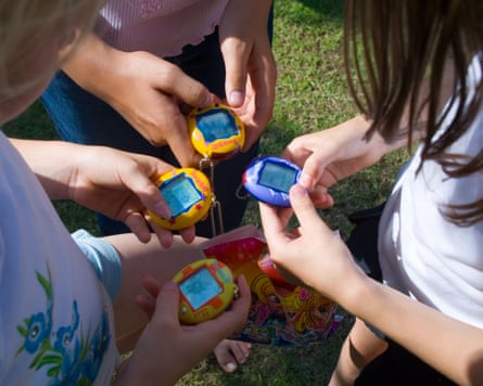 Young girls playing with their Tamagotchi toys in the mid-2000s.