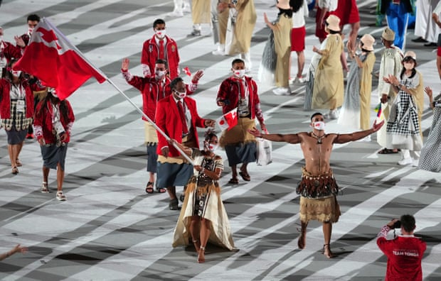 The Tonga flagbearers Malia Paseka and Pita Taufatofua lead their team out. Olympic opening ceremony,Tokyo 2020,Marco Balich,Arisa Tsubata,Tokyo,harbouchanews