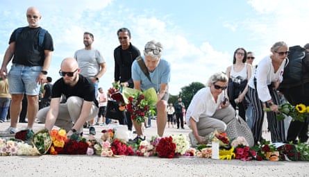People gather at the Palace Square in Oslo to pay their respects to King Harald V.