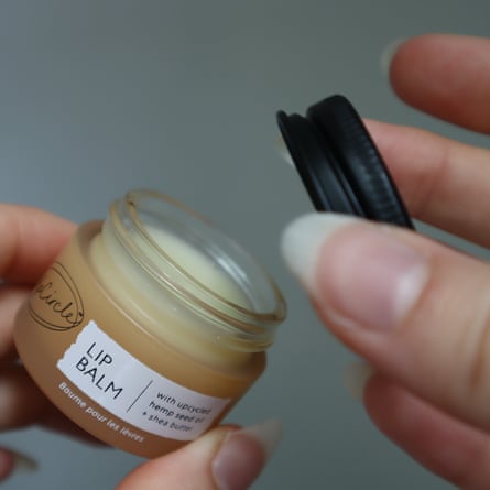 Small glass jar of Upcircle lip balm.