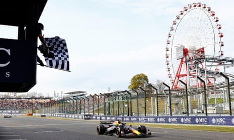 Max Verstappen passes the chequered flag to win the Japanese Grand Prix at Suzuka.