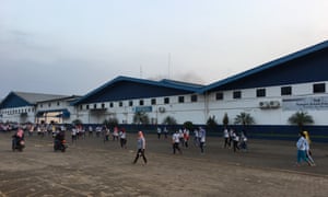 Staff arrive for work at the PT Buma factory in Suban, Indonesia, which makes Ivanka Trump’s clothing