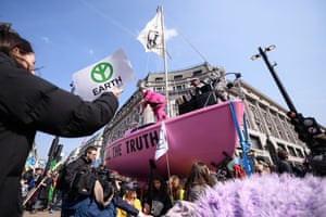 A boat is placed at the centre of the traffic junction as campaigners block Oxford Circus