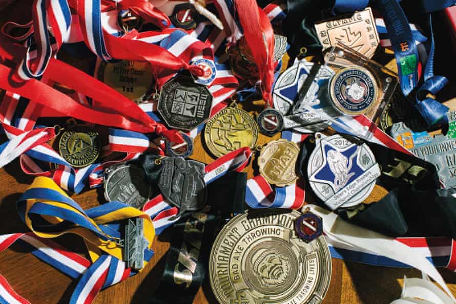 A collection of Elizabeth Swaney’s medals, trophies and accolades from various sports and competitions at her home in Oakland, California.