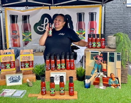 Natalie Dinning stands behind a stall table where the range of Lesley’s Sauces are displayed