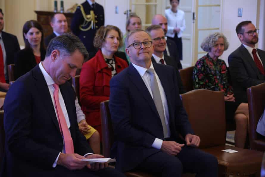 Anthony Albanese looks towards the media before he is sworn-in as prime minister.