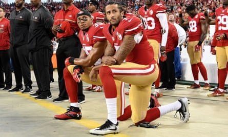 Colin Kaepernick, right, and Eric Reid of the San Francisco 49ers ‘take the knee’ in protest during a 2016 NFL game.