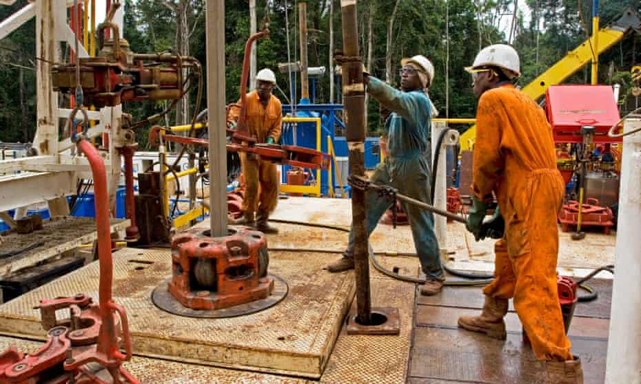 Workers at an onshore oil and gas rig site in Gabon, Africa