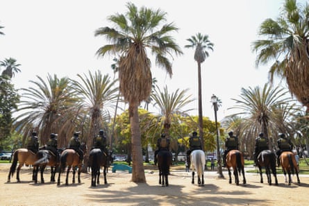 officers sitting on horses