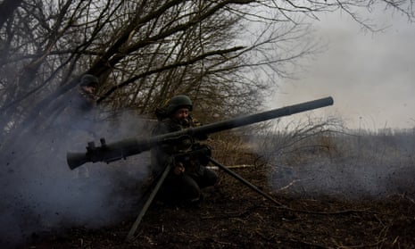Ukrainian servicemen fire an SPG anti-tank rocket launcher in the Donetsk region