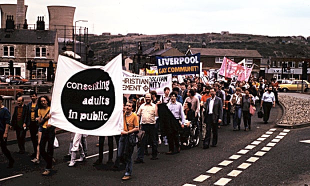 Gay Pride marchers in Huddersfield in 1981 hold banners which read 'Consenting adults in public', 'Christian element' and 'Liverpool gay community'