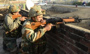 Indian soldiers take position during a combing operation after a terror attack on Pathankot airbase, in India’s Punjab state.