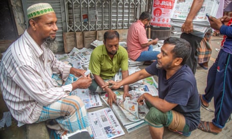 A newspaper seller in Dhaka, Bangladesh
