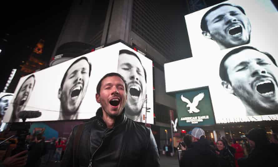 Sebastian Errazuriz in front of his video art installation A Pause in the City That Never Sleeps, which was projected on screens in Times Square in 2015.