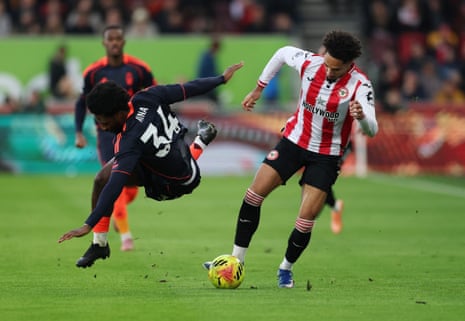 Ola Aina is all twisted up by the in-form Kevin Schade.