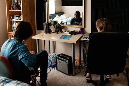 Ted and Janet Kobylecky play music in their home.