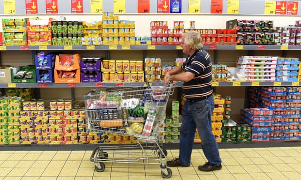 A pensioner shops in an Aldi grocery store