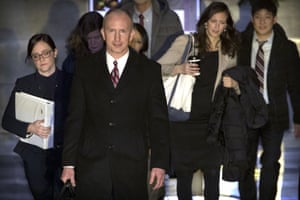 Deputy U.S. trade representative Jeffrey D. Gerrish, center, leaving his hotel this morning