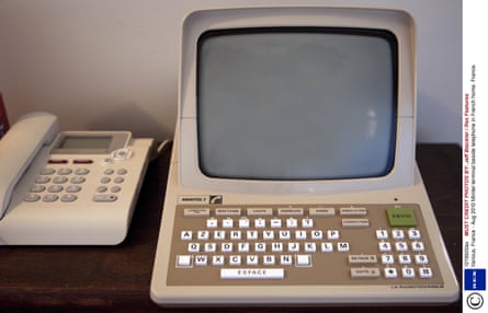 Minitel terminal beside the telephone in a French home.