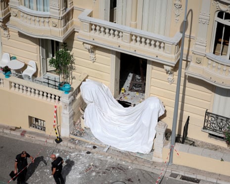 Members of a bomb disposal team operate the day after an attack involving an explosive device in the lobby of a residential building, in Monaco.