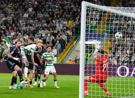 Celtic’s Liam Scales powers home a header to open the scoring against Slovan Bratislava.