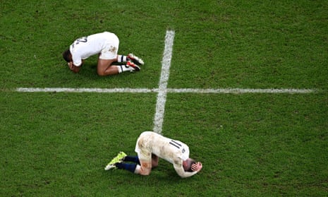 England's centre Ollie Lawrence (left) and left wing Elliot Daly react after their team's defeat in the 2023 Rugby World Cup semi-final match against South Africa.
